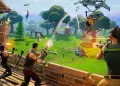 Fortnite scéna s hráči stavějícími dřevěné hradby na zelené louce pod modrým nebem, jedlý obrázek na hranatý dort