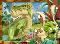 Zelený dinosaurus a jeho kamarádi v barevném pravěkém pralese mezi skalami a rostlinami, jedlý obrázek na dort