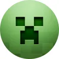 Kulatý jedlý obrázek se zelenou pixelovou tváří Creepera z hry Minecraft s černým obličejem, jedlý obrázek na dort