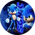Kulatý jedlý obrázek na dort: modrý ježek Sonic ve dvou pózách a svítící nápis SONIC na tmavomodrém pozadí