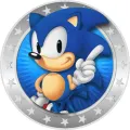 Modrý ježek Sonic s vztyčeným prstem v kulatém stříbrném medailonu s hvězdičkami a paprskovitým pozadím, jedlý obrázek na dort