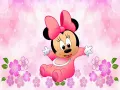 Malá Minnie s růžovou mašlí v dupačkách uprostřed kvítků a bublinek, jedlý obrázek na dort