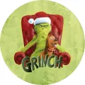 Zelený Grinch v červené čepici sedí v červeném křesle vedle hnědého pejska Maxe se zvonkem, nápis GRINCH, jedlý obrázek na dort