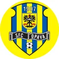 Kulatý jedlý obrázek se žluto-modrým erbem SFC Opava, s orlicí, rokem 1907 a fotbalovým míčem na žlutém pozadí, jedlý obrázek na dort