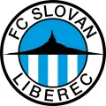 Kulatý jedlý obrázek se znakem Slovanu Liberec, modrobílé pruhy, silueta Ještědu a černý nápis na modré obloze, jedlý obrázek na dort