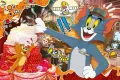 Kocour Tom v čepici a myšák Jerry u obřího vrstveného dortu, pestré barvy, jedlý obrázek na dort