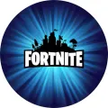 Kulatý modrý jedlý obrázek s bílým logem Fortnite, černými siluetami hradu a stromů a světelnými paprsky, jedlý obrázek na dort