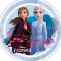 Anna a Elsa z Ledového království v modrých šatech na kulatém jedlém obrázku s ledovým hradem a sněhovými vločkami, jedlý obrázek na dort