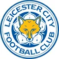 Kulatý jedlý obrázek s odznakem Leicester City: zlatá liška na bílém květu, modrý prstenec s nápisem, jedlý obrázek na dort