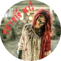 Kulatý jedlý obrázek s bledou zombie s červenými vlasy a krvavě červeným nápisem Chybíš mi, jedlý obrázek na dort