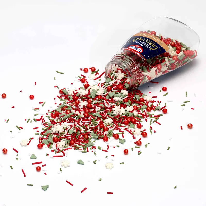 Dr. Oetker vánoční sypání v dóze s červenými perličkami, zelenými stromečky, bílými vločkami a barevnými tyčinkami na zdobení cukroví